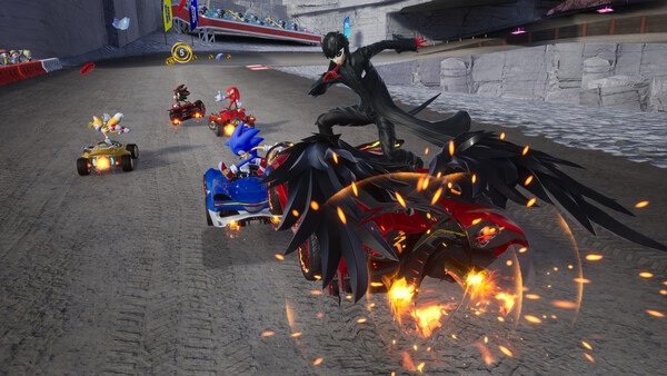 Sonic Racing: CrossWorlds screenshot showing Sonic, Knuckles, and others racing on a track, with dynamic vehicles and fiery effects.