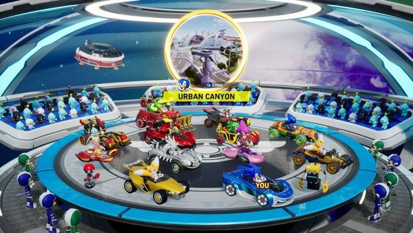 Screenshot of Sonic Racing: CrossWorlds showing colorful cars and characters lined up in the Urban Canyon selection screen.
