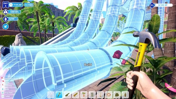 Screenshot from Waterpark Simulator showing a hand holding a hammer near a partially constructed water slide amidst tropical plants.