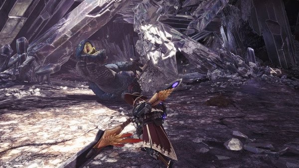 Screenshot from Monster Hunter: World showing a hunter wielding a weapon facing off against a large monster in a crystal cavern.