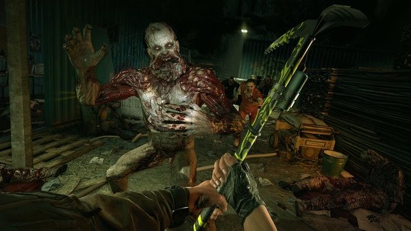Dying Light screenshot: A player wields a weapon against a grotesque zombie in a dark, cluttered environment.