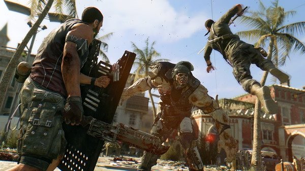 A Dying Light screenshot showing intense combat with zombies, survivors wielding weapons, and palm trees in the background.