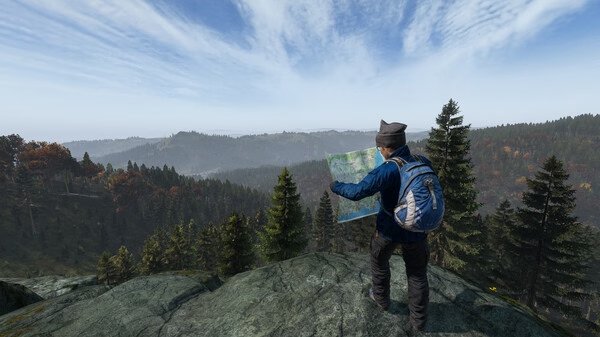 DayZ screenshot: A character with a backpack holds a map, standing on a rocky cliff overlooking a vast forest landscape.