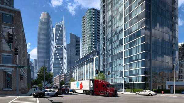 A screenshot from American Truck Simulator showing a red truck hauling cargo through a busy urban street with tall modern buildings.