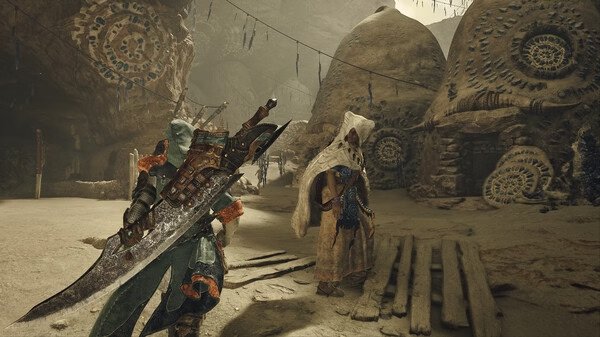 Monster Hunter Wilds screenshot: A hunter with a large sword approaches a cloaked figure in a desert village setting.