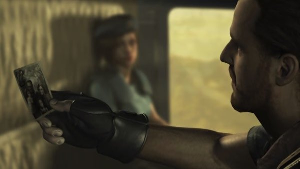 Resident Evil HD Remaster screenshot: A character holds a photo while another, wearing a blue uniform, stands in the background.