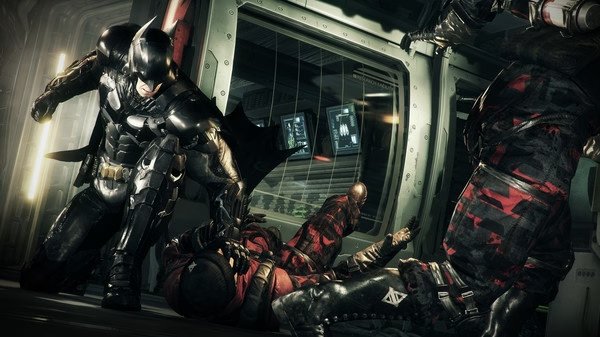 Batman: Arkham Knight screenshot. Batman battles armored enemies in a high-tech facility, showcasing dynamic combat action.