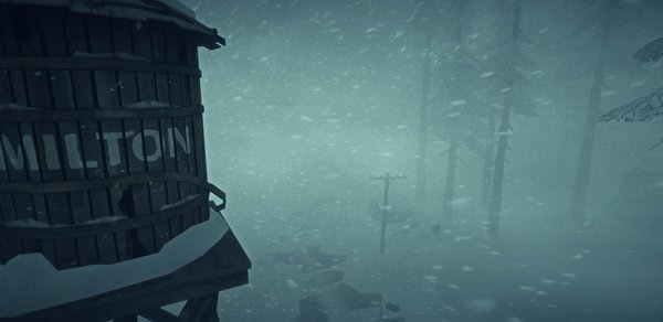 A screenshot from The Long Dark showing a snowy scene with a Milton water tower, trees, and power lines fading into the blizzard.