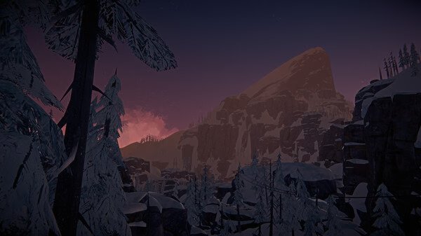 Screenshot from The Long Dark showing a snowy mountain landscape at dusk, with trees and rocky cliffs silhouetted against a colorful sky.