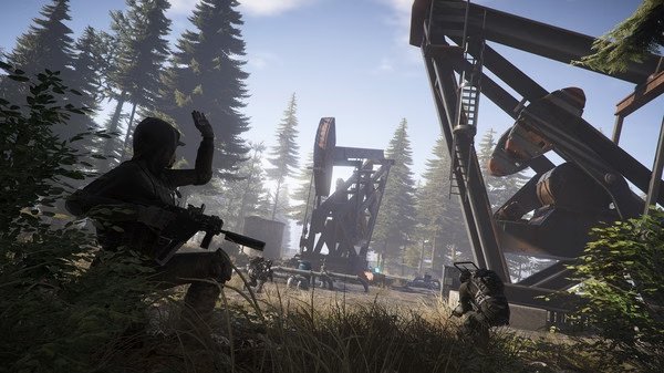 A screenshot from Tom Clancy's Ghost Recon Wildlands showing a soldier hiding near trees beside oil pump structures in daylight.