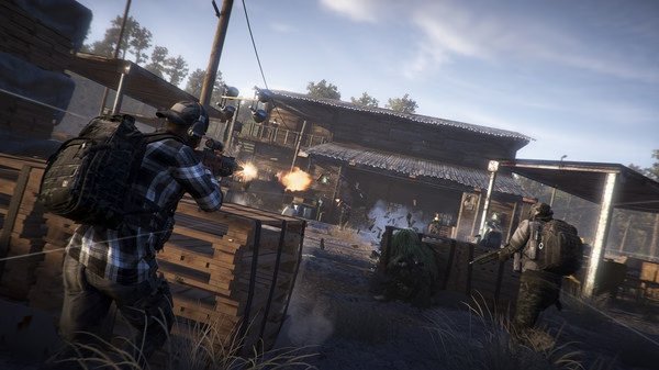 A tactical team in combat gear engages enemies at a rural outpost in this 'Tom Clancy's Ghost Recon Wildlands' screenshot.