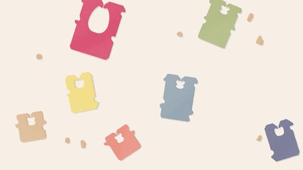 Screenshot from 'A Little to the Left' showing various colorful bread clips scattered randomly on a light background.
