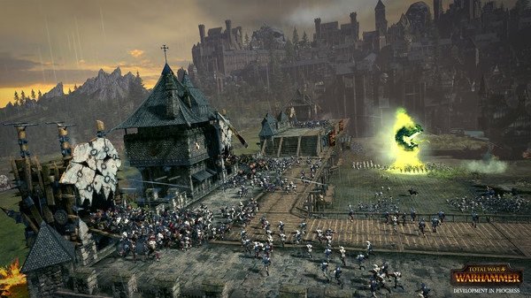 Screenshot from Total War: WARHAMMER showing a large army advancing towards a fortified city with a glowing portal.