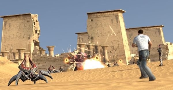 A screenshot from Serious Sam 3: BFE showing the player facing alien enemies in a desert setting near ancient ruins.