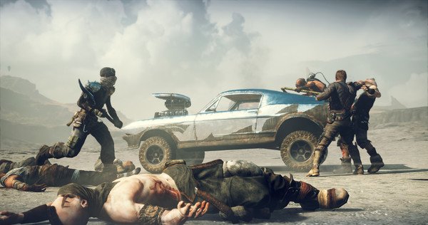 Screenshot from Mad Max game: Characters engage in combat near a rugged, blue vehicle amidst a desert landscape.