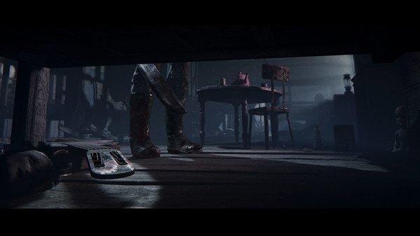 Outlast 2 screenshot: A tense scene shows bloodstained boots and a machete under a table in a dimly lit room.
