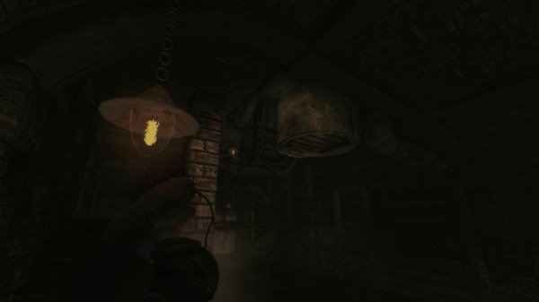 Screenshot from Amnesia: A Machine for Pigs shows a dimly lit industrial tunnel with rusted pipes and a glowing hanging lamp.
