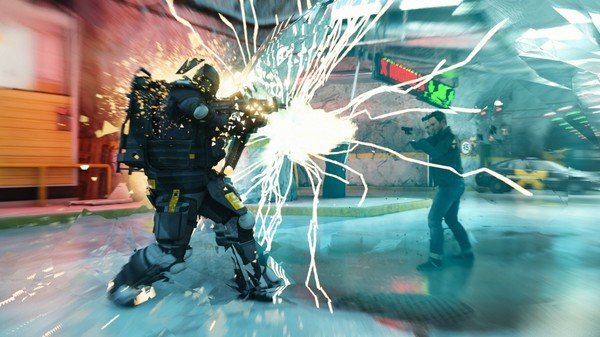 Quantum Break screenshot: A character stands facing a heavily armored enemy amidst a burst of energy in a chaotic environment.