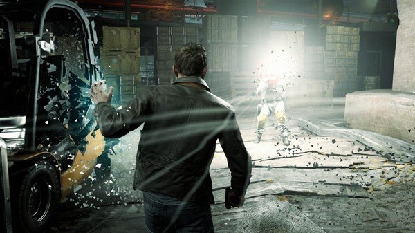 Quantum Break screenshot: A man in a leather jacket confronts an enemy in a warehouse, with time manipulation effects visible.