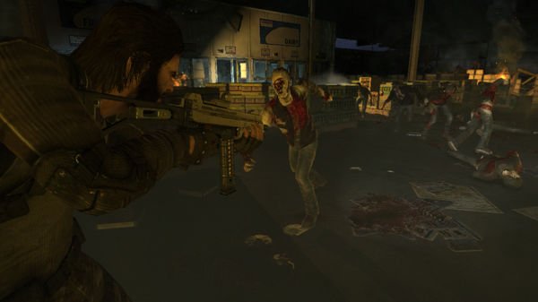 F.E.A.R. 3 screenshot: A player aims a weapon at approaching zombies in a dimly lit, chaotic warehouse setting.