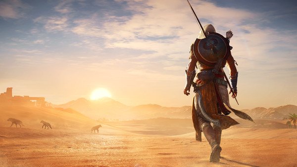 Assassin's Creed Origins screenshot of a warrior walking through a desert at sunset, with wild animals in the distance.