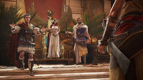Screenshot of Assassin's Creed Origins showing characters in Egyptian attire in a grand hall with a throne.