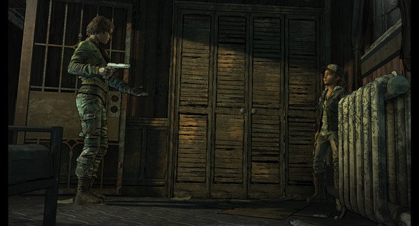 Screenshot from The Walking Dead: The Telltale Definitive Series showing two characters in a tense standoff near a wooden wardrobe.