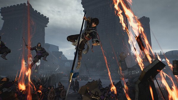 Dynasty Warriors: Origins screenshot of a warrior leaping with a spear amidst flames and a battle in front of castle walls.