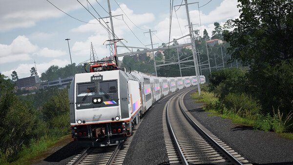 Train Sim World 6 screenshot showing a modern passenger train traveling through a scenic forested area on curved railway tracks.