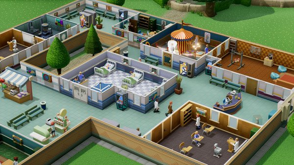 Screenshot of Two Point Hospital showing a bustling hospital interior with patients, staff, and various treatment rooms.