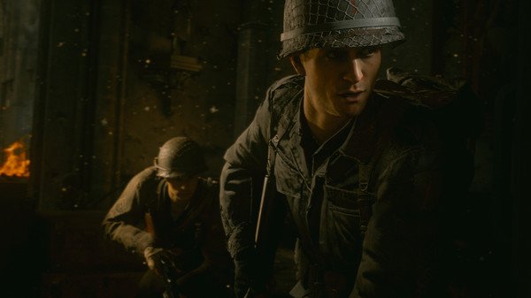 Call of Duty: WWII screenshot featuring two soldiers in helmets and combat gear, one in focus and the other partially visible in the background.