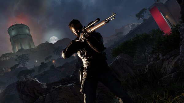 Screenshot from Sniper Elite: Resistance showing a sniper aiming his rifle in a rocky, moonlit landscape with a tower in the background.