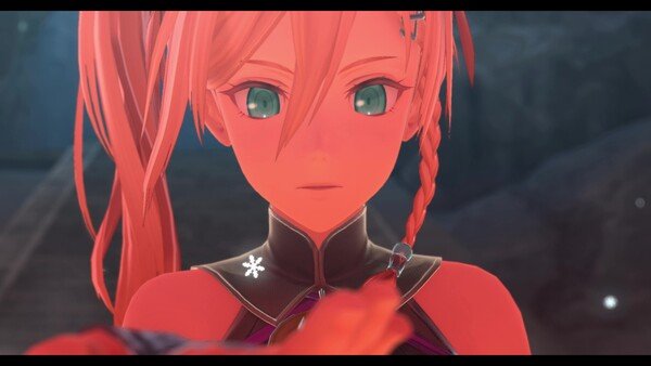 Screenshot from Ys X: Proud Nordics showing a close-up of a character with red hair and bright eyes, facing forward.