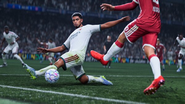 EA SPORTS FC 27 screenshot: A player in a white uniform slides to intercept the ball from an opponent in red on a grassy field.