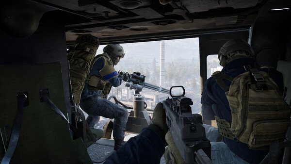 WARDOGS screenshot: Two armed soldiers inside a helicopter aiming weapons at a cityscape visible through the open door.