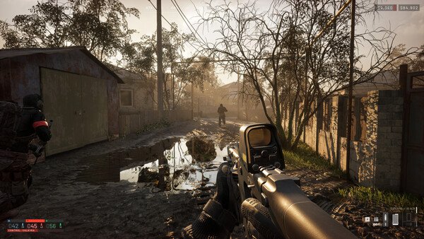WARDOGS screenshot: A player-character aims down sights at an enemy in a muddy, abandoned neighborhood surrounded by trees.